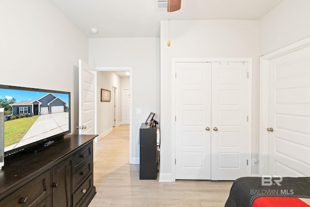 bedroom featuring light hardwood / wood-style floors and a closet