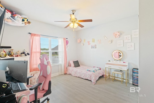 bedroom featuring light hardwood / wood-style flooring and ceiling fan