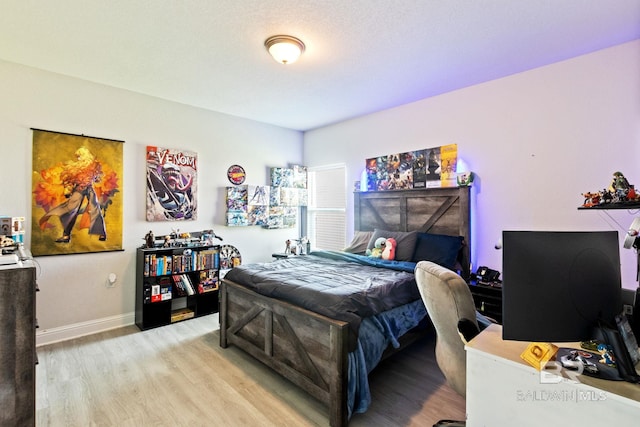 bedroom with light hardwood / wood-style flooring