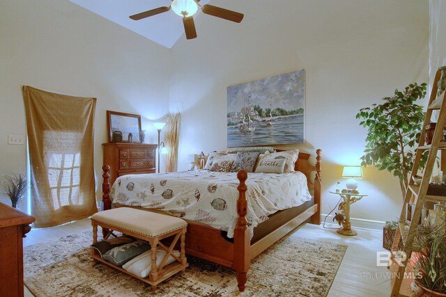 1912 Brigadoon Trl, Gulf Shores, AL 36542 - bedroom with wood finished floors, ceiling fan, and high vaulted ceiling
