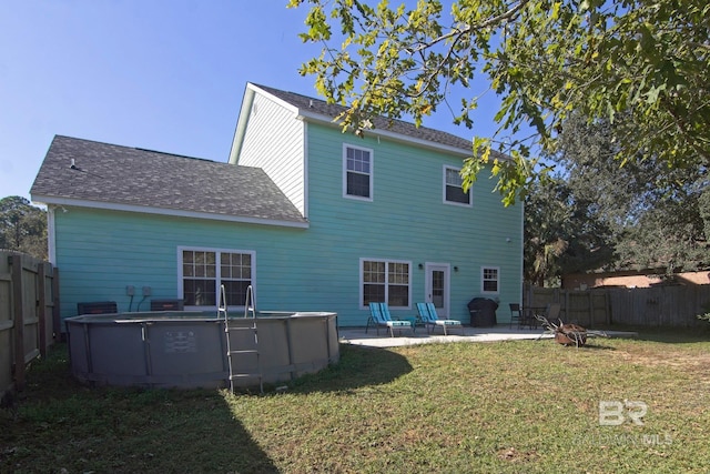 1912 Brigadoon Trl, Gulf Shores, AL 36542 - back of property with a patio and roof with shingles
