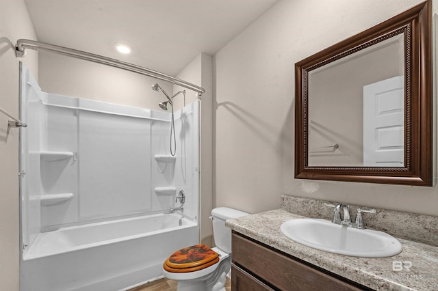 full bathroom featuring vanity, toilet, and washtub / shower combination