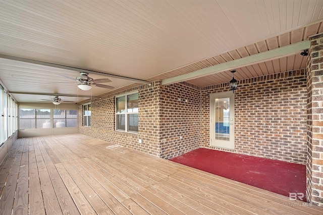 wooden terrace featuring a ceiling fan