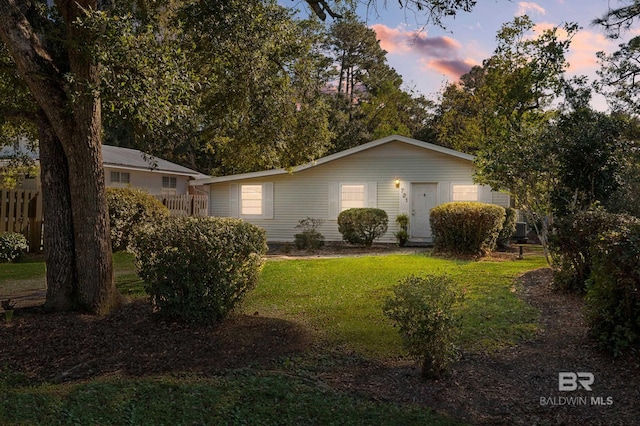 view of front of home with a yard