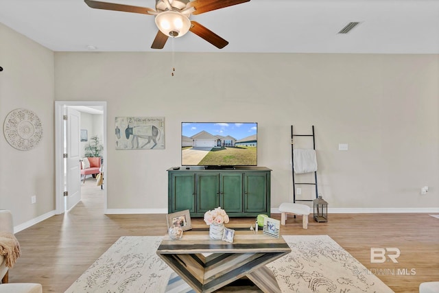 1203 Hayward Loop, Foley, AL 36535 - living room with light wood-style floors, visible vents, ceiling fan, and baseboards