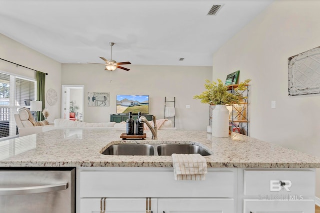1203 Hayward Loop, Foley, AL 36535 - kitchen featuring visible vents, stainless steel dishwasher, open floor plan, a sink, and light stone countertops