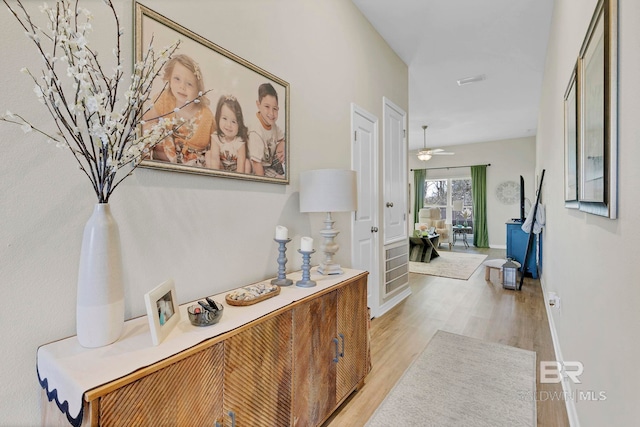 1203 Hayward Loop, Foley, AL 36535 - corridor with light wood finished floors and baseboards