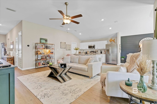 1203 Hayward Loop, Foley, AL 36535 - living area featuring lofted ceiling, light wood-style floors, visible vents, and recessed lighting