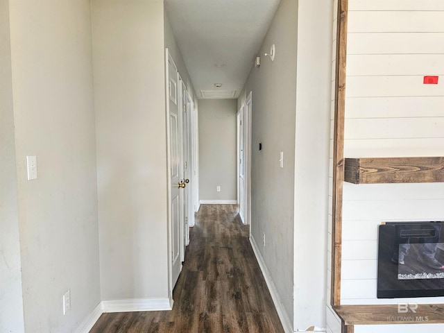 hallway with dark wood-type flooring