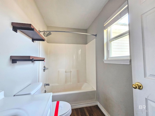 full bathroom featuring vanity, wood-type flooring,  shower combination, and toilet