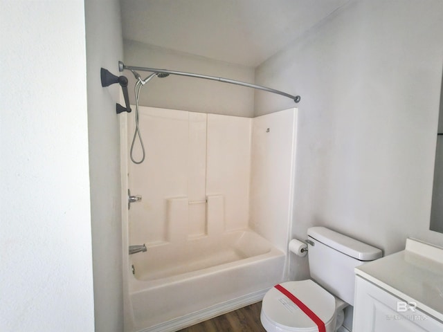 full bathroom featuring shower / bath combination, vanity, hardwood / wood-style flooring, and toilet