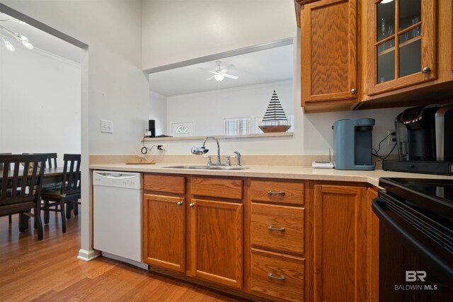 4 Yacht Club Dr Unit 174, Daphne, AL 36526 - kitchen with white dishwasher, a sink, a ceiling fan, brown cabinetry, and ornamental molding