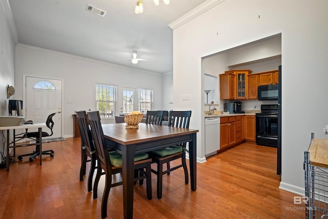 4 Yacht Club Dr Unit 174, Daphne, AL 36526 - dining space featuring crown molding, a ceiling fan, light wood finished floors, and baseboards