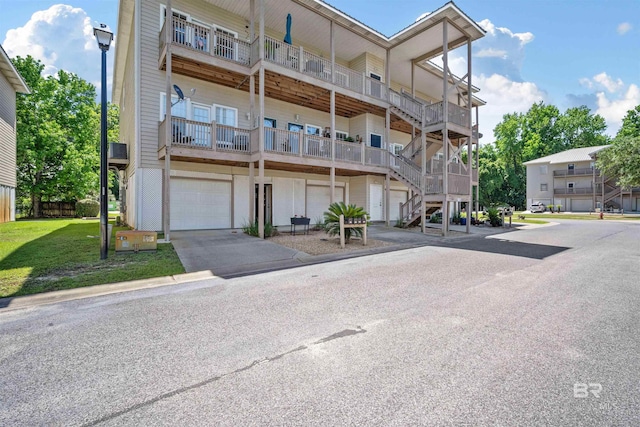 4 Yacht Club Dr Unit 174, Daphne, AL 36526 - view of apartment building / complex featuring an attached garage and driveway