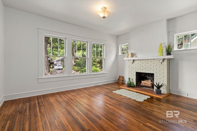 121 Westwood St, Mobile, AL 36606 - unfurnished living room with baseboards, hardwood / wood-style floors, and a fireplace