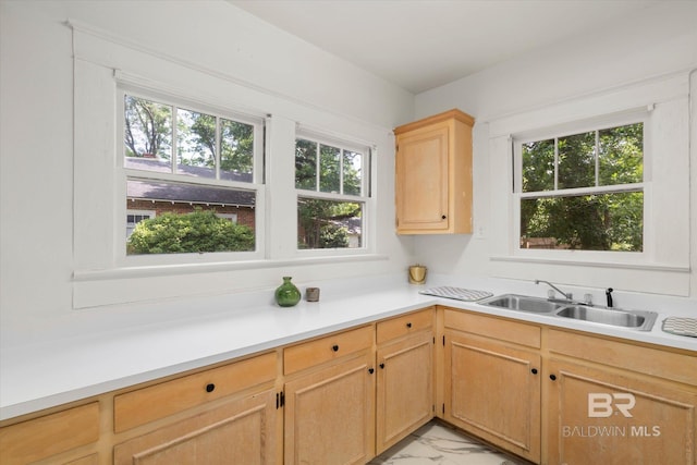 121 Westwood St, Mobile, AL 36606 - kitchen featuring light brown cabinets, marble finish floor, a sink, and plenty of natural light
