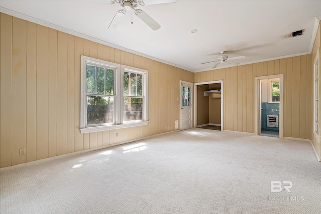121 Westwood St, Mobile, AL 36606 - unfurnished bedroom with ceiling fan, carpet floors, crown molding, and wooden walls