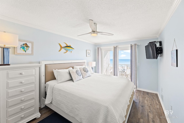 bedroom featuring ceiling fan, ornamental molding, dark hardwood / wood-style floors, and access to exterior