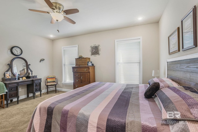 bedroom with ceiling fan and carpet floors