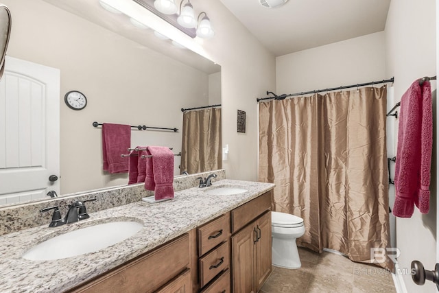 bathroom with vanity, toilet, and walk in shower