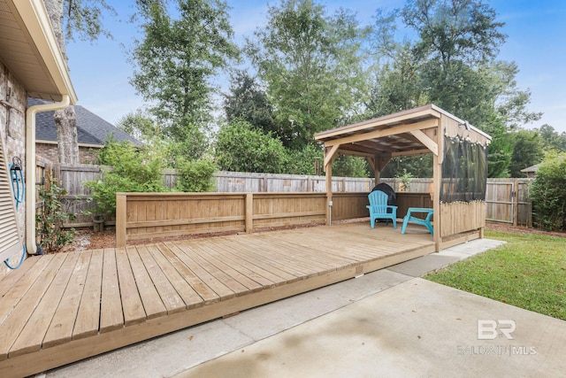 wooden terrace with a gazebo, a patio area, and a yard