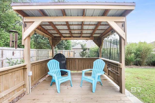 wooden terrace with a yard