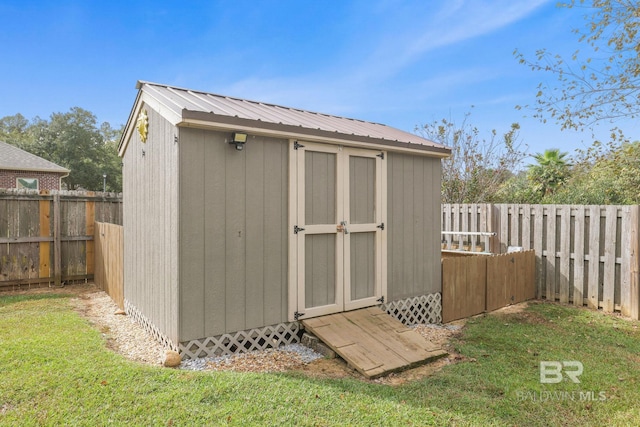 view of outdoor structure with a lawn