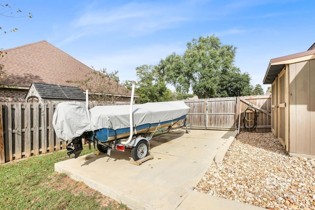 view of patio featuring a storage shed