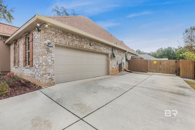 view of property exterior featuring a garage