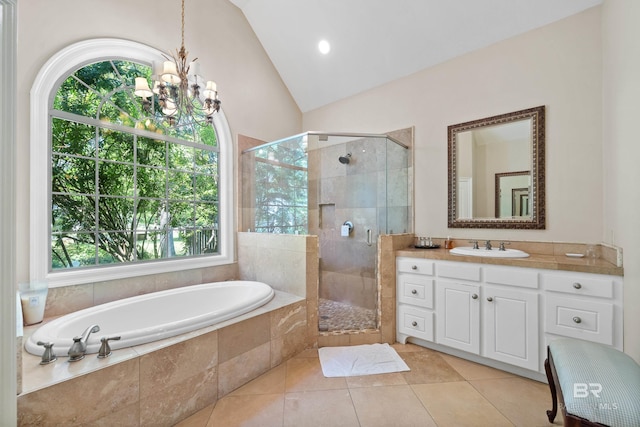 bathroom featuring lofted ceiling, a stall shower, an inviting chandelier, a bath, and vanity