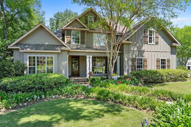 view of front of house featuring a front yard and board and batten siding