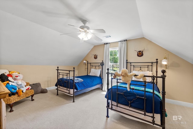 carpeted bedroom with lofted ceiling, visible vents, ceiling fan, and baseboards