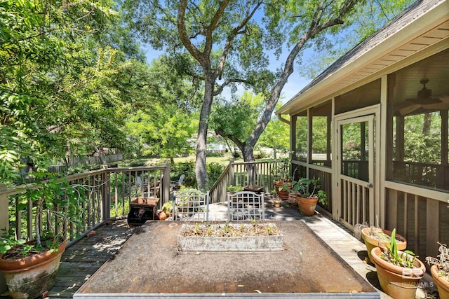 view of patio featuring a sunroom and a deck