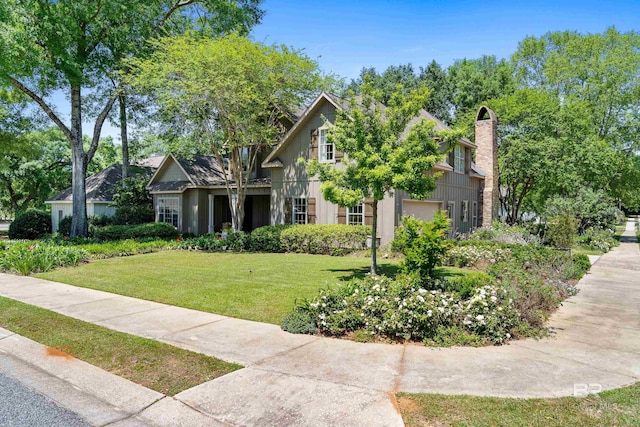 view of front of property featuring a front lawn and a chimney