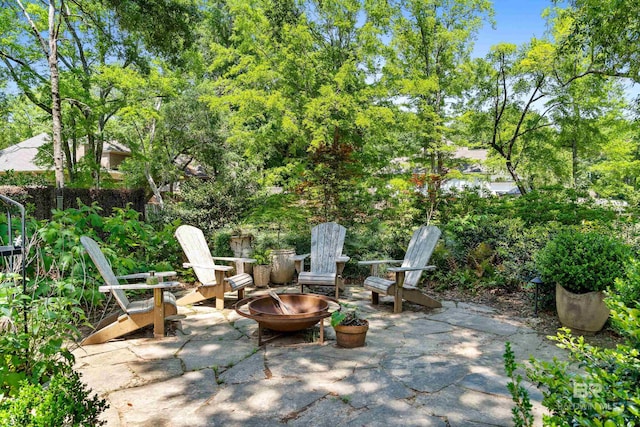 view of patio / terrace featuring an outdoor fire pit