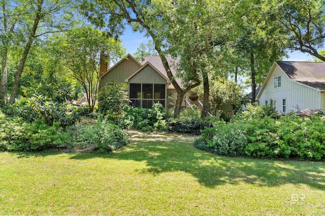 view of yard with a sunroom