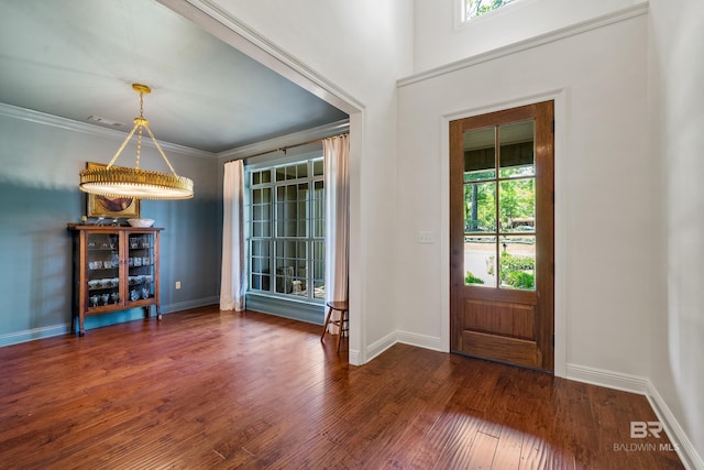 entrance foyer with a wealth of natural light, wood finished floors, and baseboards