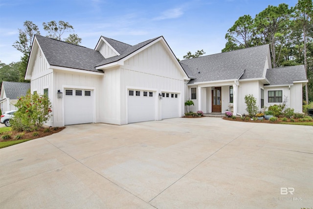 modern inspired farmhouse with a garage