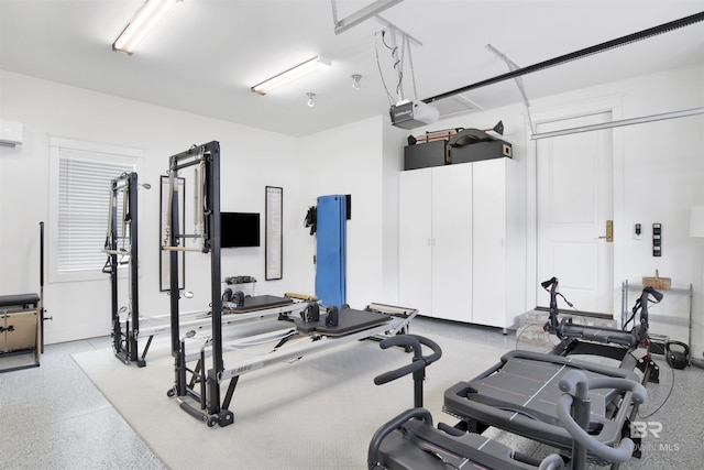 exercise room with a wall mounted AC