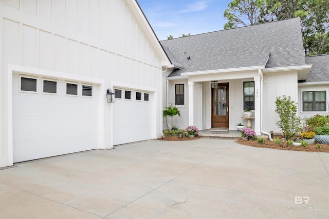 modern inspired farmhouse with a garage