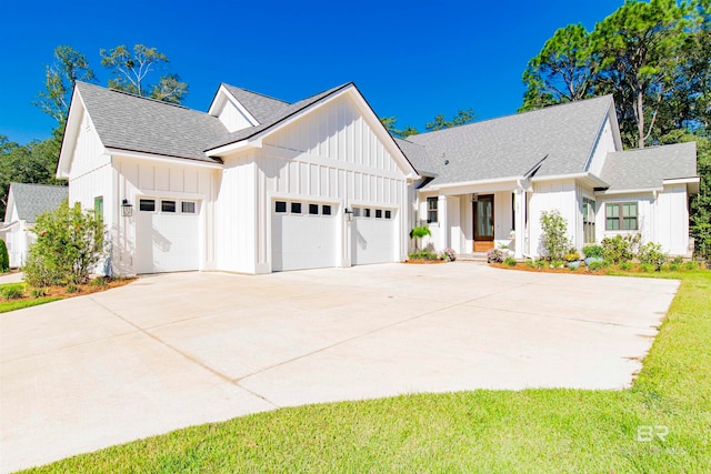 modern inspired farmhouse featuring a garage