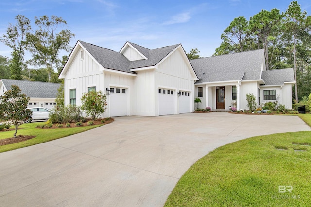 modern inspired farmhouse with a garage