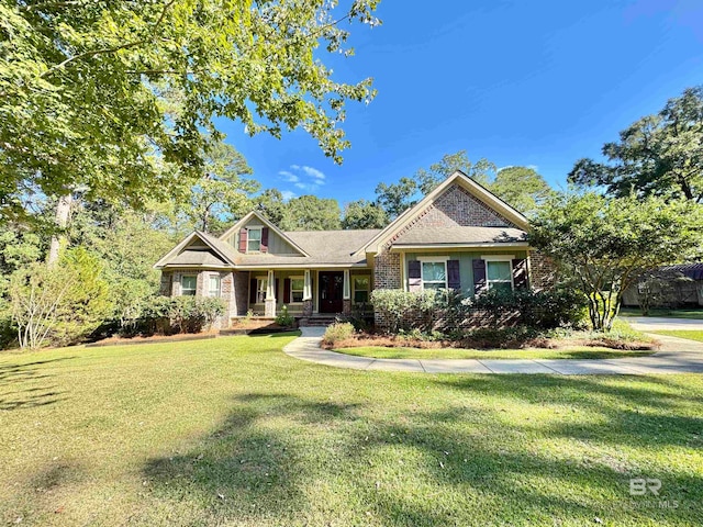 craftsman house featuring a porch and a front yard