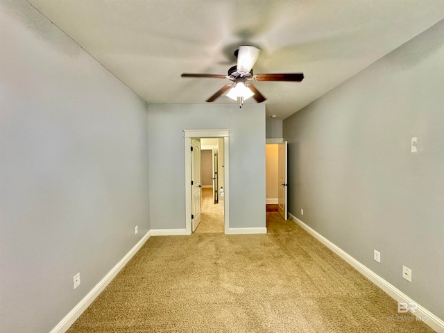 unfurnished bedroom with light carpet and ceiling fan