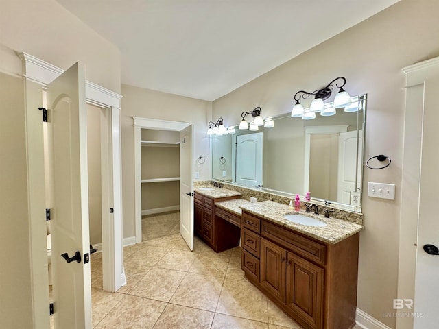 bathroom with vanity and tile patterned flooring