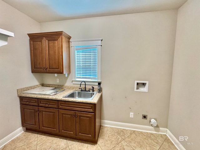 kitchen featuring light tile patterned flooring and sink