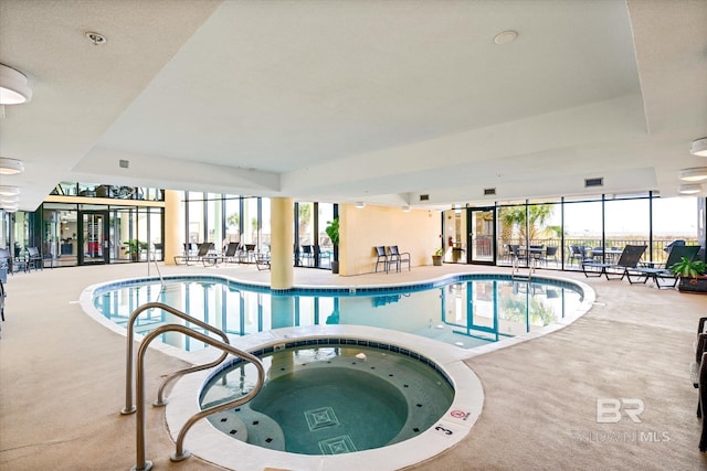 pool with an indoor in ground hot tub