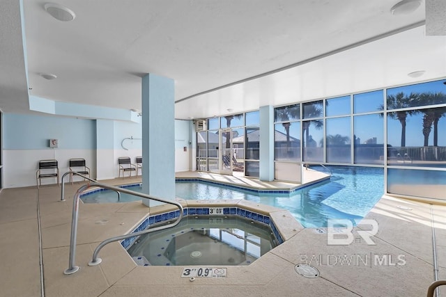 view of pool featuring an indoor hot tub