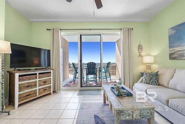 living area with tile patterned floors and ceiling fan