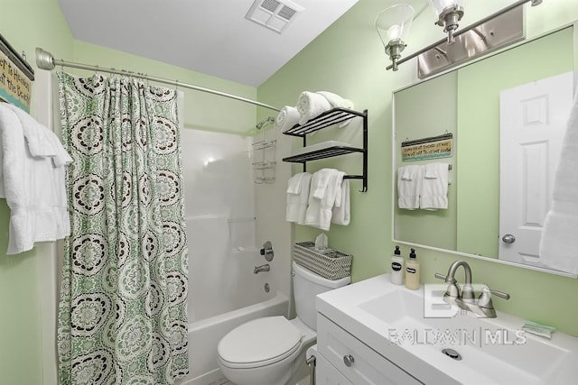 bathroom featuring vanity, toilet, visible vents, and shower / tub combo with curtain